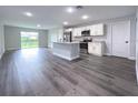 Open concept kitchen with island and stainless steel appliances at 13435 Kaplan Ter, Port Charlotte, FL 33981
