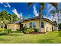 Well-maintained house with tropical landscaping at 39 Tee View Pl, Rotonda West, FL 33947