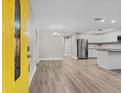 Open concept living and kitchen area with modern flooring and finishes at 304 W Fern St, Tampa, FL 33604