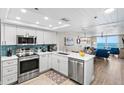 Modern kitchen with stainless steel appliances and ocean view at 20000 Gulf Blvd # 707, Indian Shores, FL 33785