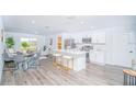 Modern kitchen with island and stainless steel appliances at 17207 Waldrun Ave, Port Charlotte, FL 33948