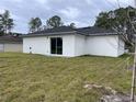 Rear view of a newly built home at 17207 Waldrun Ave, Port Charlotte, FL 33948
