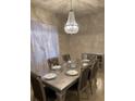 Elegant dining room with a large table and chandelier at 6327 Yellow Buckeye Dr # 6327, Riverview, FL 33578