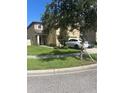 Two-story house with a front yard and driveway at 6327 Yellow Buckeye Dr # 6327, Riverview, FL 33578