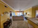 Bright living room with access to the balcony and views of the living spaces at 4333 Bayside Village Dr # 314, Tampa, FL 33615