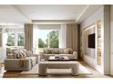 Spacious living room featuring modern decor, large windows, and neutral-colored couches at 125 Baytree Dr, Rotonda West, FL 33947
