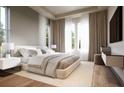 Serene main bedroom featuring a king-size bed, light-colored walls and oversized window at 125 Baytree Dr, Rotonda West, FL 33947