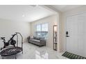Inviting entryway with neutral tones, stylish marble floors, and ample natural light from a bright window at 7522 Rosewood Garden Loop, Tampa, FL 33637