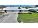 Inviting single-story home showcasing a well-kept lawn, concrete driveway, and tiled roof in a serene community at 6522 11Th W Ave, Bradenton, FL 34209