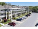 Condominium exterior featuring well-maintained balconies and parking at 2210 Utopian E Dr # 314, Clearwater, FL 33763