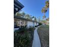 Exterior angle shot of a house, revealing its architectural details and landscaping at 355 Highland Shores Dr, Ellenton, FL 34222