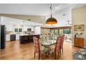 Open floor plan features a dining area and kitchen with a breakfast bar at 1025 Royal Troon Ct, Tarpon Springs, FL 34688