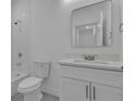 Clean bathroom featuring white fixtures, vanity with white countertop, and a bathtub at 488 Sunset N Rd, Rotonda West, FL 33947