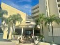 Inviting condo exterior featuring palm trees and a covered entrance offering an impressive welcome at 6009 Sea Ranch Dr # 101, Hudson, FL 34667