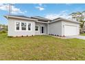 Charming single-story home with a two-car garage, landscaped yard and brick paver driveway at 4160 Belladonna Ave, North Port, FL 34286