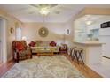 Bright living room featuring laminate flooring, comfortable seating, ceiling fan and an open layout at 219 S Mcmullen Booth Rd # 175, Clearwater, FL 33759