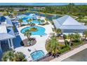 Beautiful community pool featuring sun loungers, an in-pool gazebo, and a hot tub at 5820 Shorebird Br, Land O Lakes, FL 34638