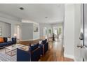Living room with hardwood floors, neutral paint, and modern furniture at 19713 Ellendale Dr, Land O Lakes, FL 34638