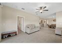 Spacious living room showcases an open layout and tiled flooring at 13475 Crest Lake Dr, Hudson, FL 34669