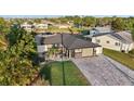 Aerial view of the renovated home and lush surroundings, located on the water with private boat dock at 5036 Bonito Dr, New Port Richey, FL 34652