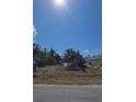 Construction site view on sunny day with heavy machinery and freshly moved earth at 487 Sunset N Rd, Rotonda West, FL 33947