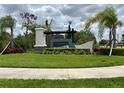 Hillwood Preserve community entrance sign with stone and wood accents surrounded by lush landscaping at 17130 11Th Ter E, Bradenton, FL 34212