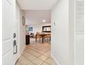 Welcoming entryway that leads to an open-concept living and dining area with tile flooring at 6151 Bahia Del Mar Blvd # 125, St Petersburg, FL 33715