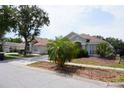 Home exterior showcases a well-manicured lawn and mature landscaping at 10308 Soaring Eagle Dr, Riverview, FL 33578