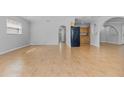 Bright, empty living room with tile flooring, arched doorways, and ample natural light at 4408 W Prescott St, Tampa, FL 33616