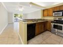 Well-equipped kitchen featuring stainless steel appliances, granite countertops, and ample cabinetry at 2700 Coconut Bay Ln # 419, Sarasota, FL 34237
