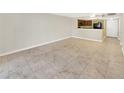 Bright living room featuring tile flooring and an open view to the kitchen area at 2700 Coconut Bay Ln # 419, Sarasota, FL 34237