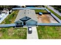 Aerial view of the single-Gathering home in a partially fenced lot with mature trees at 6315 Hillview Rd, Spring Hill, FL 34606