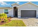 Beautiful single-Gathering home with well-manicured landscaping and a paved driveway at 11330 Burgundy Dr, Venice, FL 34293
