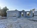 View of new construction with gray concrete walls, showcasing potential for a modern, custom-built home at 122 Naomi Pl, Rotonda West, FL 33947