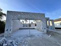 The image shows a garage with a concrete structure, waiting to be transformed into a personalized space at 122 Naomi Pl, Rotonda West, FL 33947