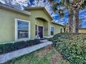 Inviting home with lush landscaping, showcasing a welcoming entrance and well-maintained walkway at 1718 Trailwater St, Ruskin, FL 33570