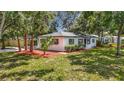 Well-maintained home with landscaping and mulch, offering great curb appeal at 4202 W Bay Vista Ave, Tampa, FL 33611