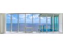 Living room with expansive windows offering stunning water views at 2900 Bay To Bay Blvd # 1502, Tampa, FL 33629