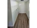 Bright laundry room with new flooring and modern finishes at 128 E 145Th Ave, Tampa, FL 33613