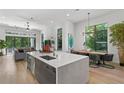 Open concept kitchen with large island and hardwood floors at 4304 W Sevilla St, Tampa, FL 33629