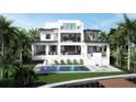Beautiful backyard with a sparkling pool, lounge chairs and a covered patio area at 2417 S Dundee St, Tampa, FL 33629