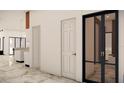 Interior hallway with modern doors and marble flooring at 110 W Floribraska Ave, Tampa, FL 33603