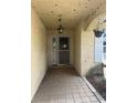 Front entry with tiled floor and arched entryway at 1404 Midoneck Ct, Valrico, FL 33596