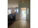 Home entryway with tiled floor and door to living area at 1404 Midoneck Ct, Valrico, FL 33596
