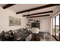 Spacious living room featuring a sectional sofa and exposed wooden beams at Lot 11 Bayshore Dr, Safety Harbor, FL 34695