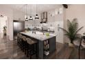 Modern kitchen with a large island, stainless steel appliances, and white cabinetry at Lot 11 Bayshore Dr, Safety Harbor, FL 34695