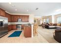 Spacious kitchen with stainless steel appliances and an island at 320 Ibisview Lane # 33572, Apollo Beach, FL 33572