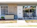 Condo exterior with patio furniture and landscaping at 4329 Tahitian Gardens Cir # B, Holiday, FL 34691