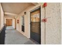 Building hallway with light colored walls and doors at 8901 Blind Pass Rd # 228, St Pete Beach, FL 33706