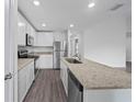 Modern kitchen featuring stainless steel appliances and granite countertops at 5389 Ulysses St, Port Charlotte, FL 33981